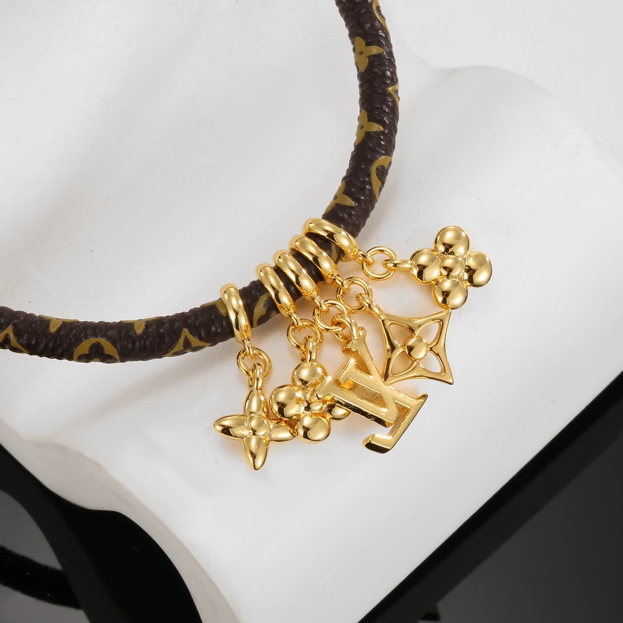 Louis Vuitton Monogram Leather Bracelet with Gold Charms